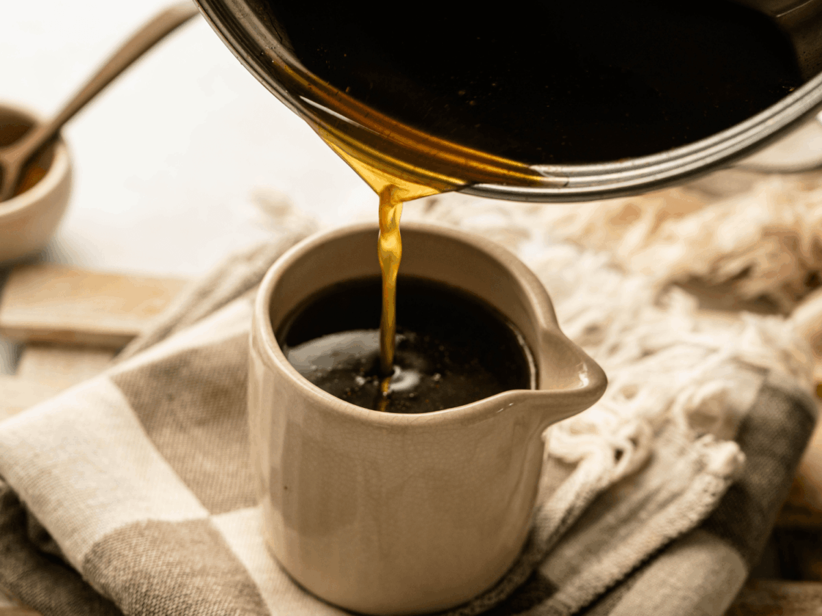 photo showing pumpkin spice ingredients being poured into a cream container