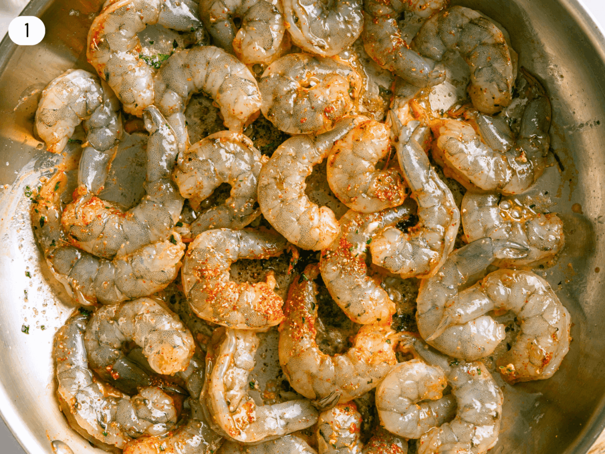 step 1 photo showing seasoned shrimp searing in a pan