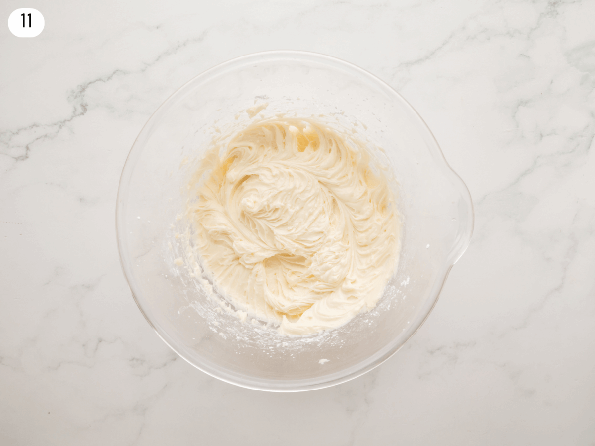 step 11 photo showing the cream cheese frosting after it's mixed together