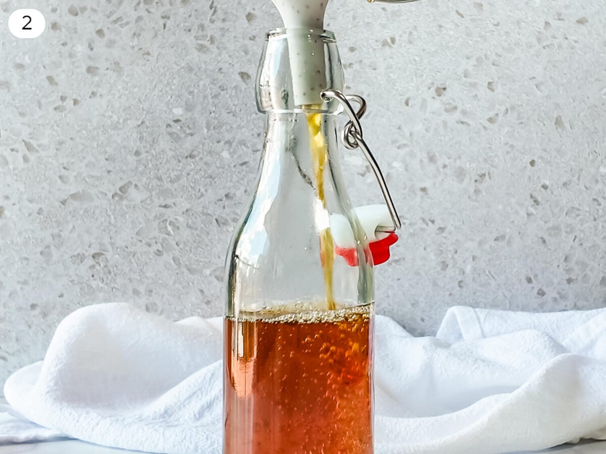 step 2 photo of cooled Demerara Syrup being poured into an airtight container