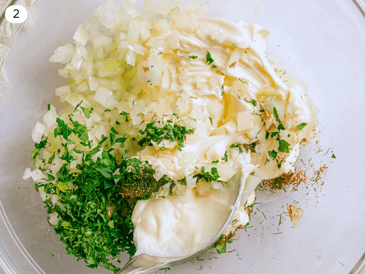 step 2 photo showing ingredients in a glass bowl to make the dressing