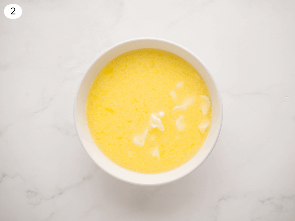step 2 photo showing melted butter and milk in a bowl