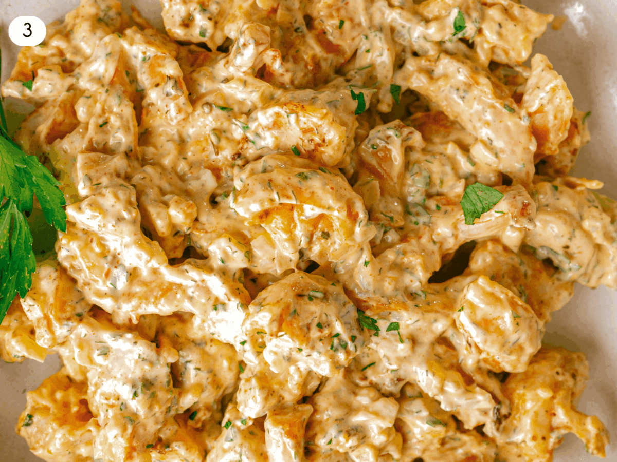 step 3 photo showing shrimp tossed in the mayo based dressing