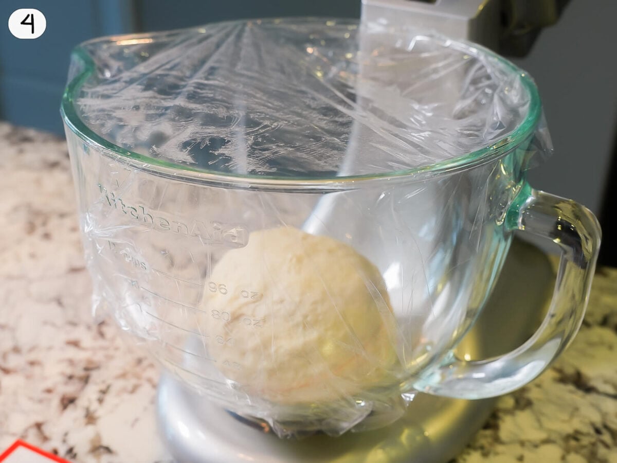 step 4 photo of dough ball resting in a mixing bowl