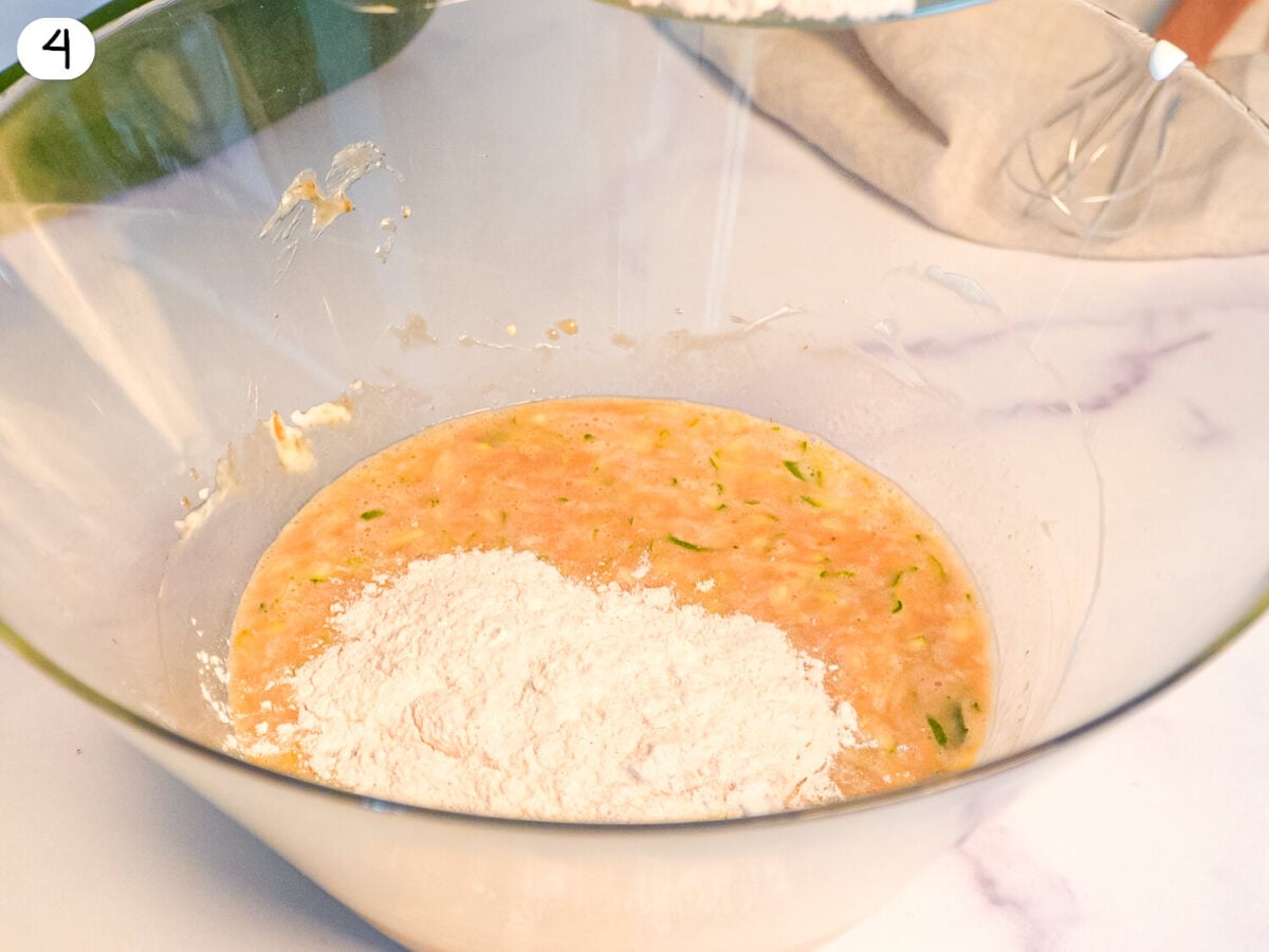 step 4 photo showing dry ingredients being added to the wet ingredient bowl
