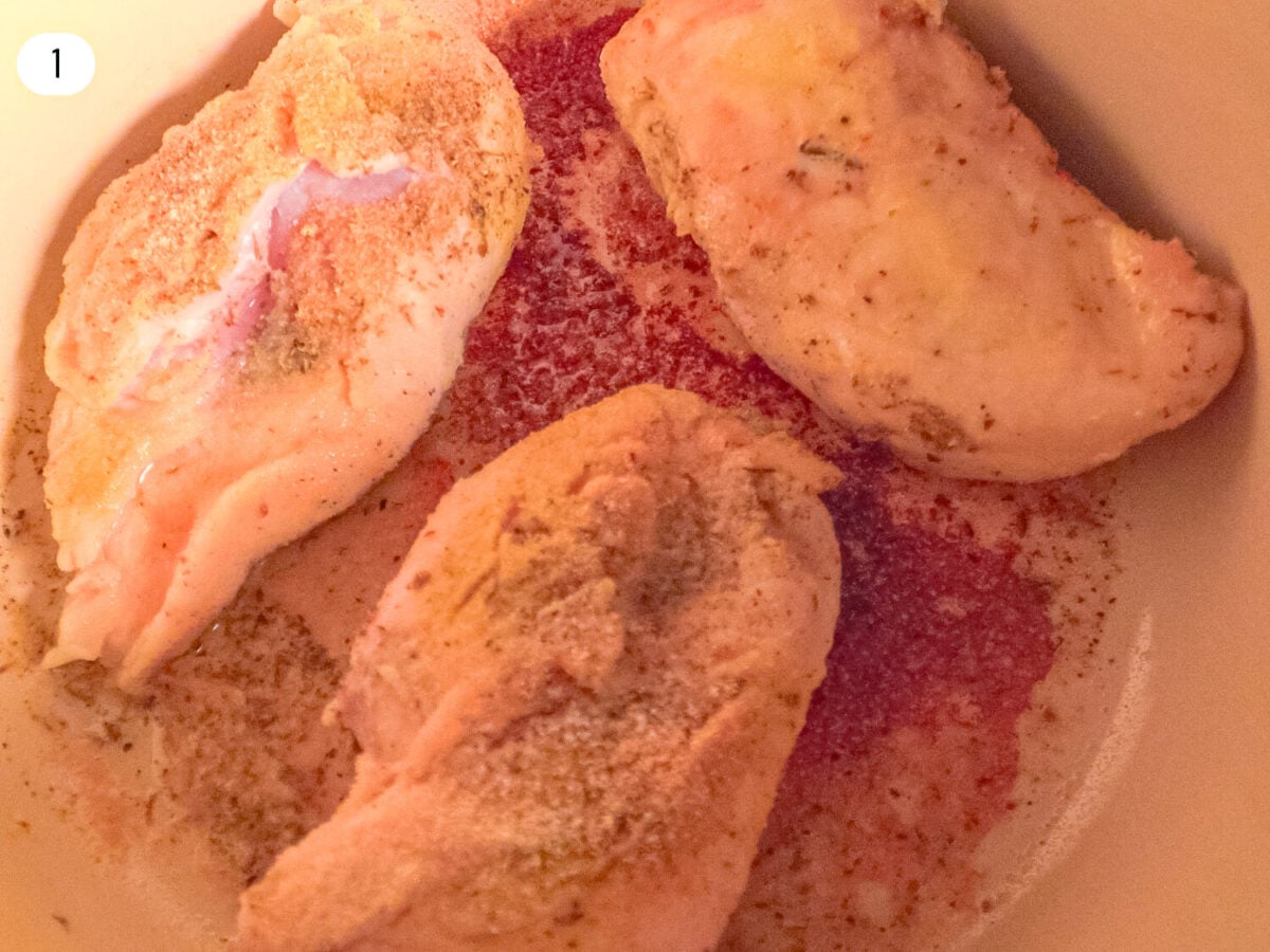 STEP 1 photo showing the Prep and Seasoning of the Chicken inside the dutch oven