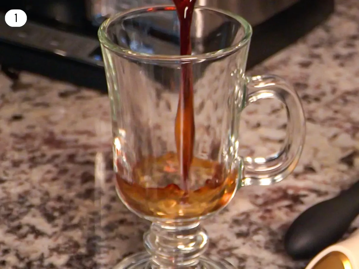 Step 1 photo of brewed espresso being poured into a cup