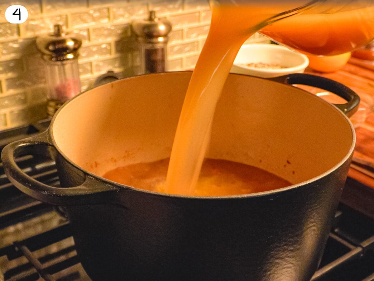 Step 4 photo showing the chicken stock being added to the pot