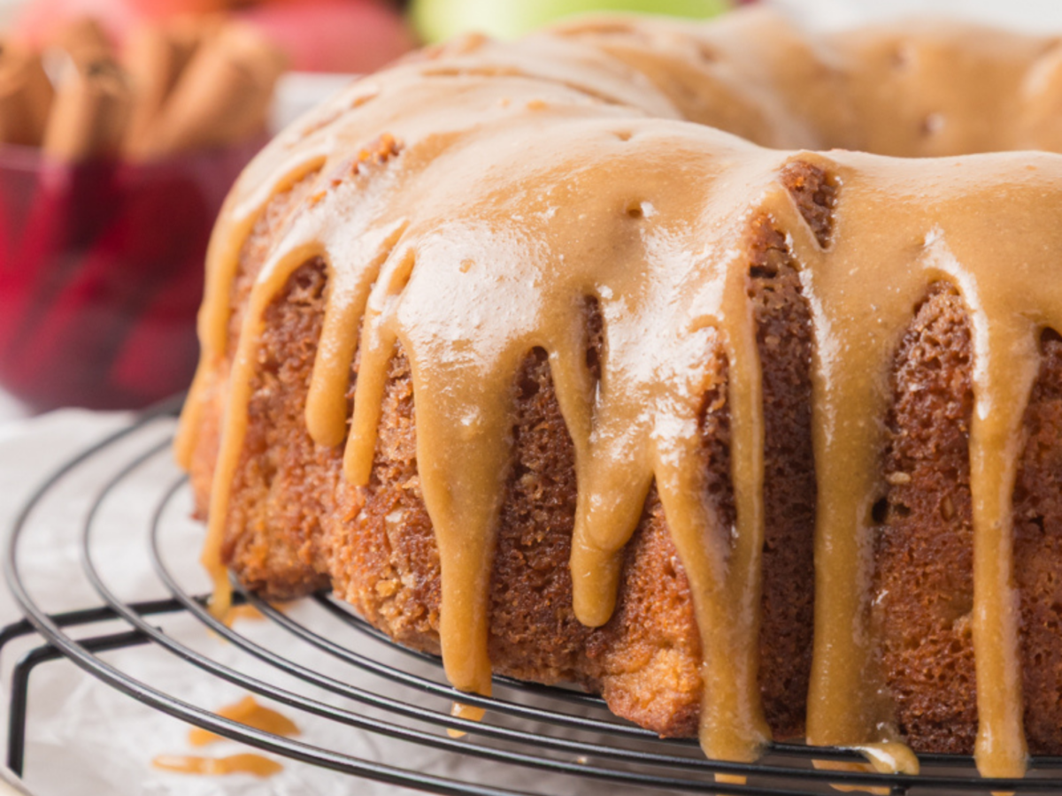 close up photo of caramel drizzle on an apple bundt cake