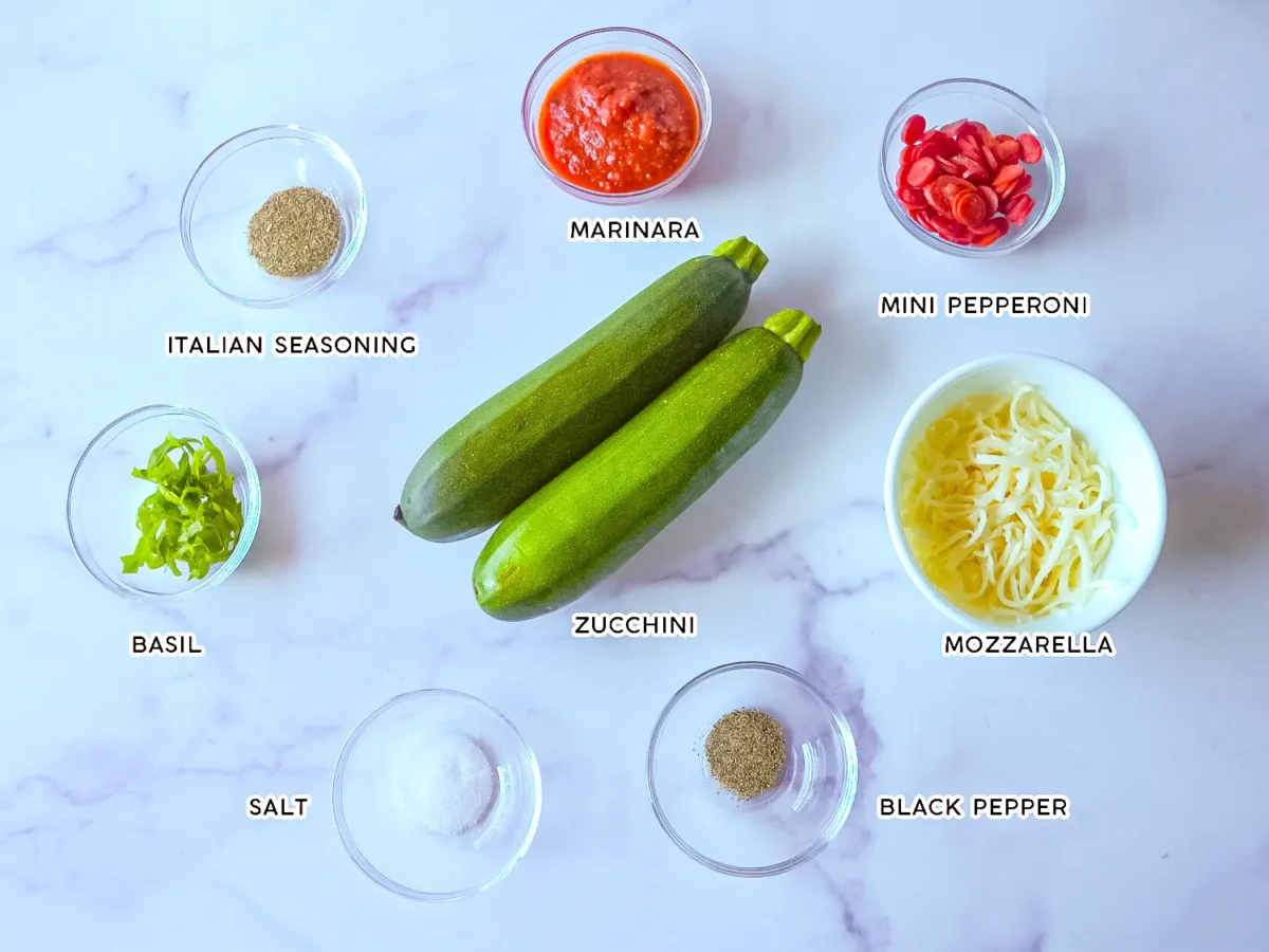 photo of Zucchini Pizza Bites ingredients on a marble surface