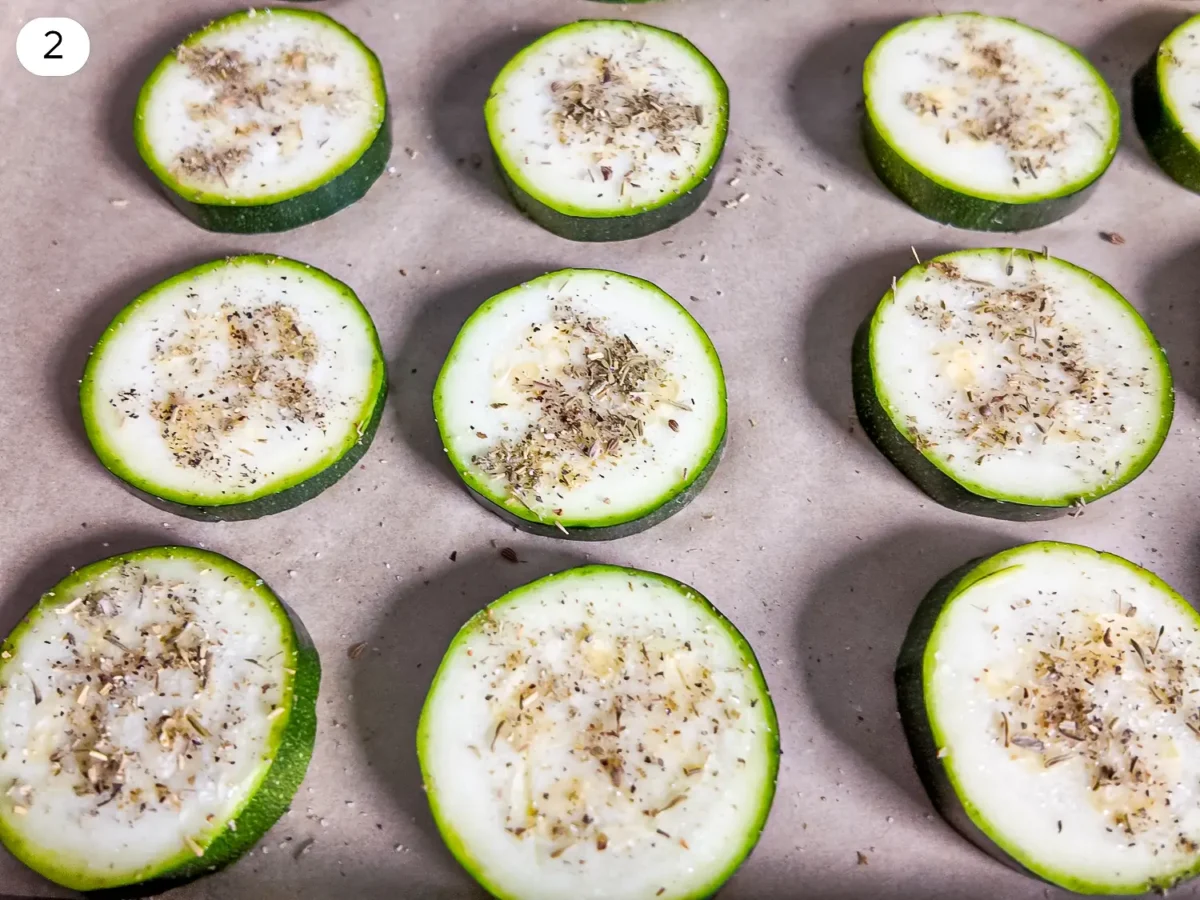 step 2 photo showing seasoning of zucchini slices