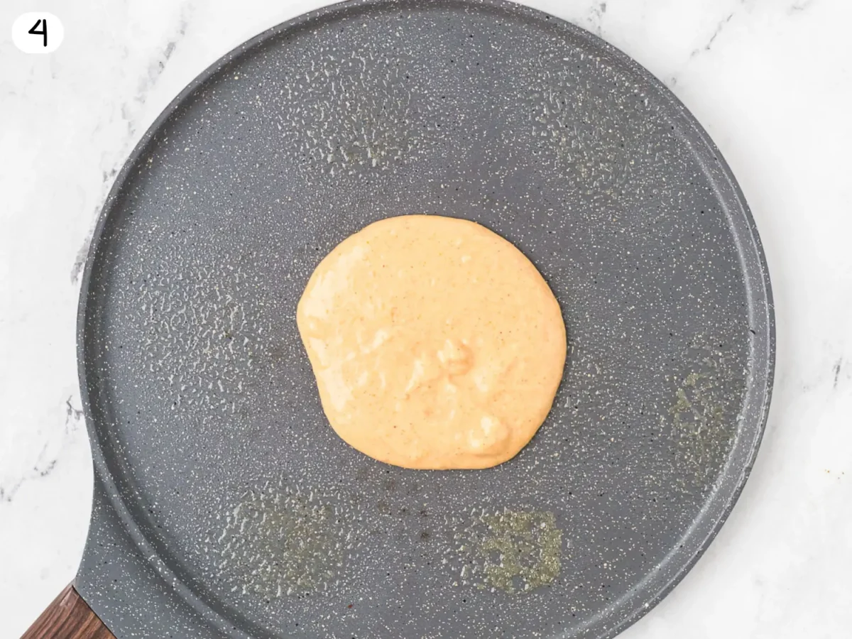 step 4 photo showing pancake cooking in a gray pan