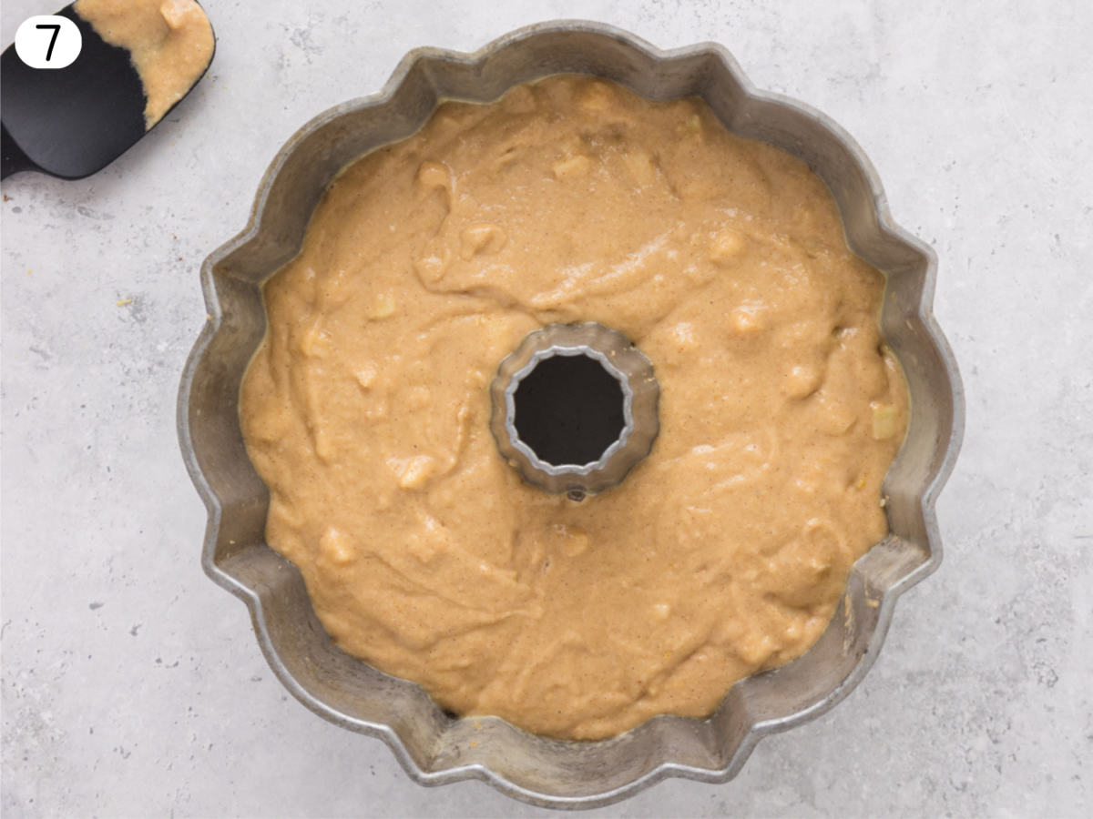 step 7 showing apple bundt cake batter in the bundt pan before it is baked