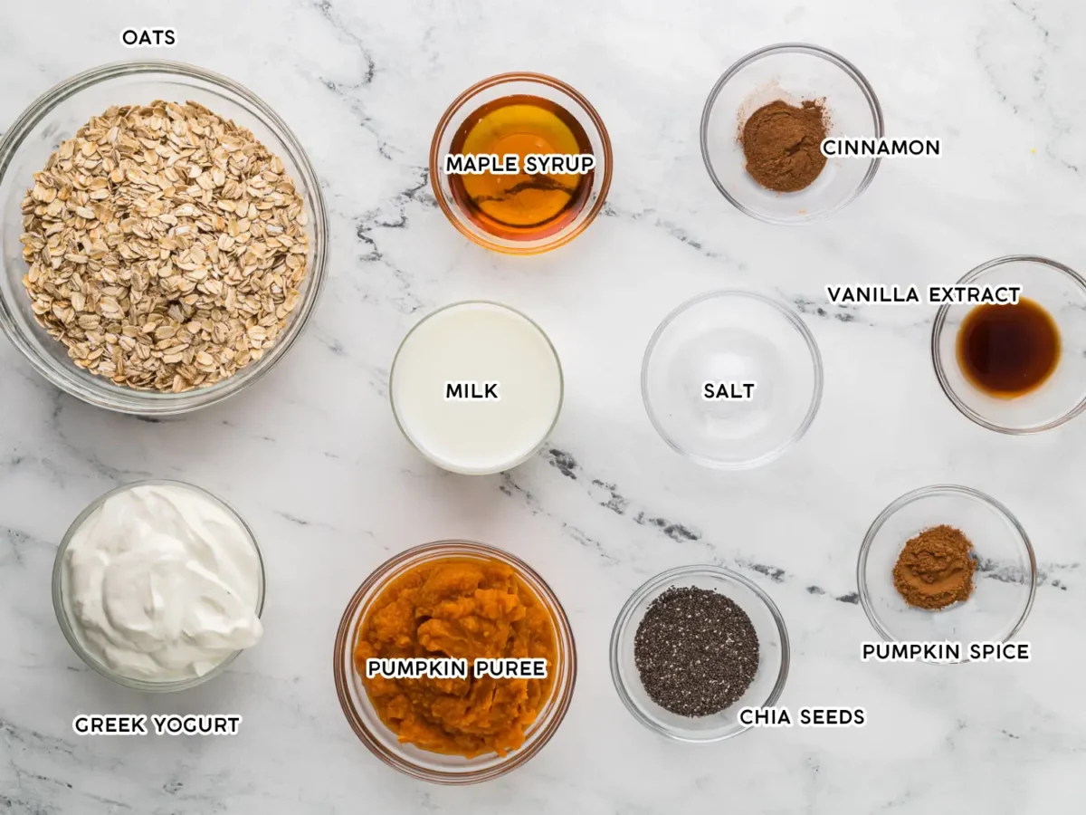 Photo of pumpkin overnight oats ingredients on a marble surface