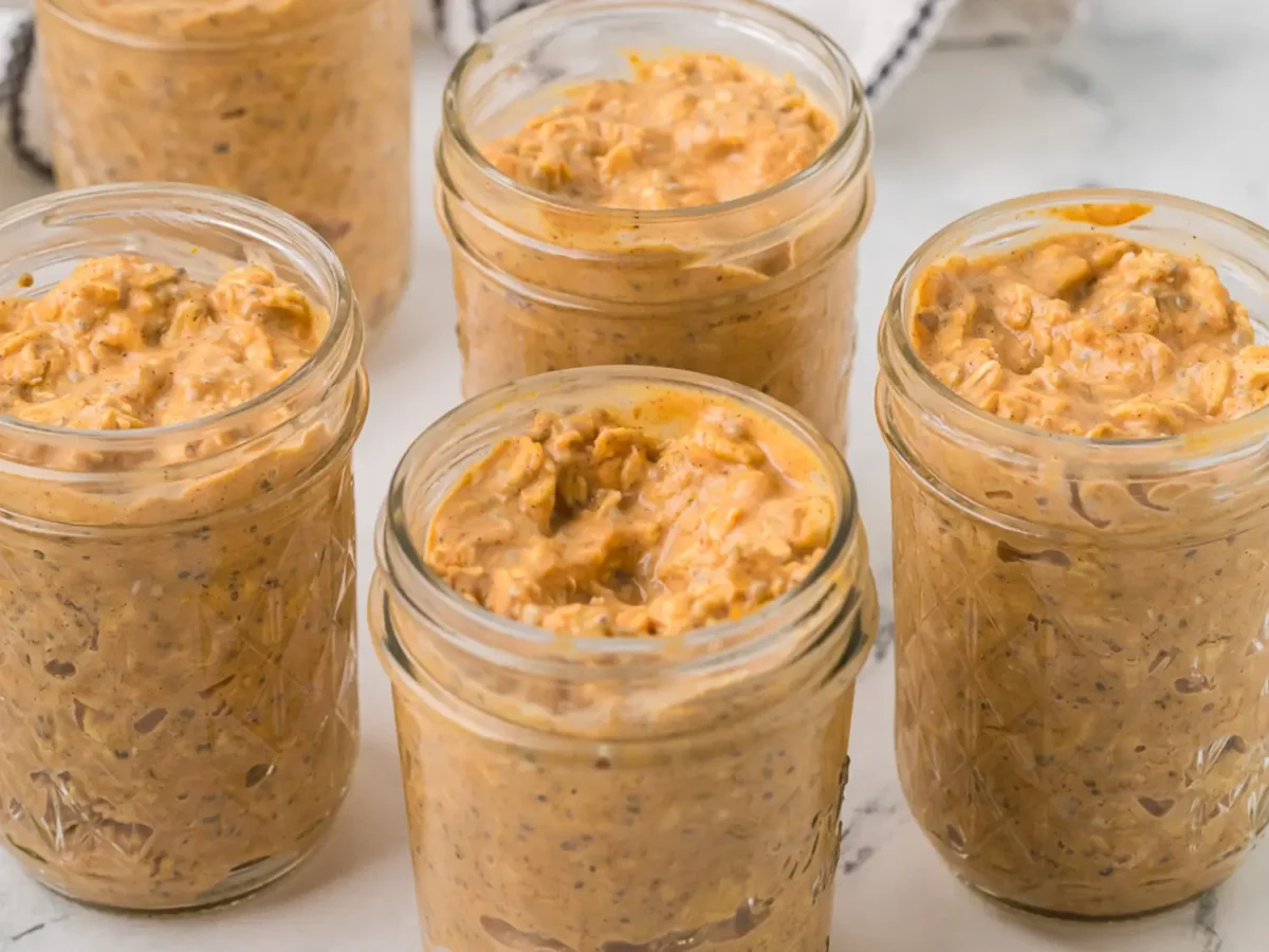 overhead photo of pumpkin overnight oats in mason jars