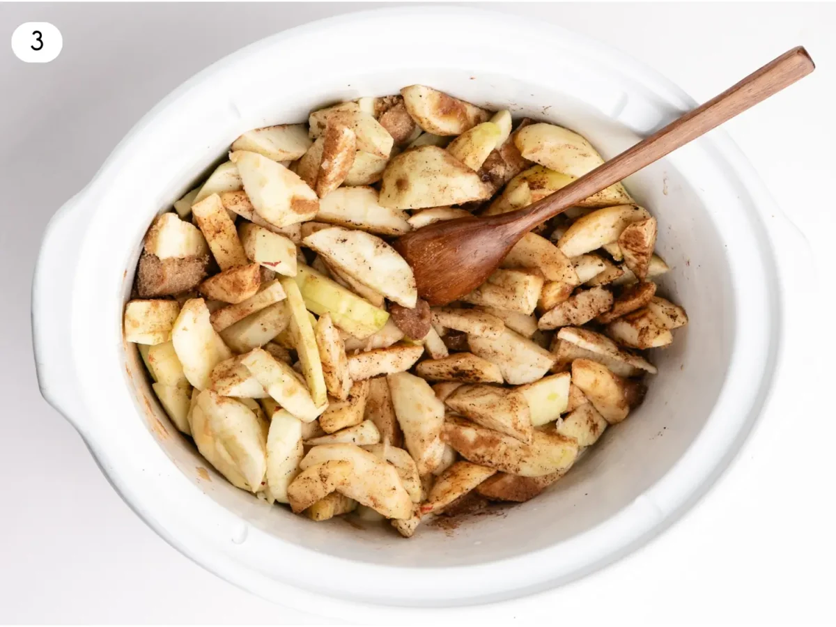 step 3 photo showing seasoned apples that are stirred with water