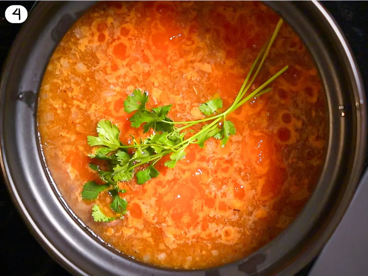 step 4 photo of cilantro sprigs being added to the pot of rice