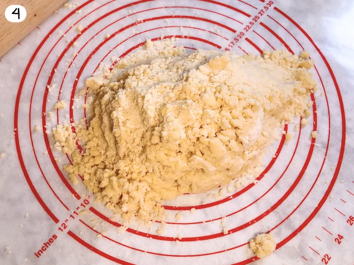 step 4 photo showing pie dough placed on a silicone mat before it is shaped