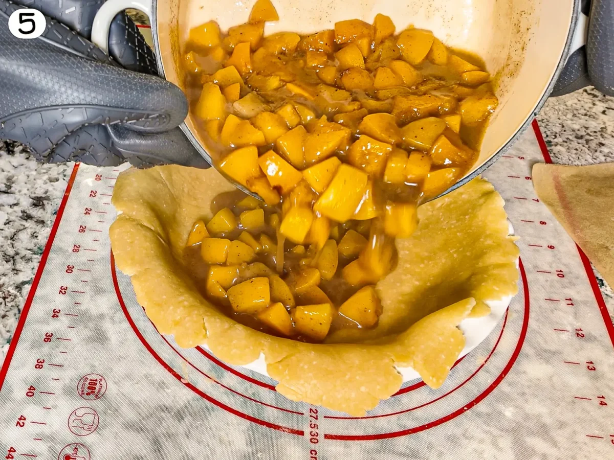 step 5 photo showing pie filling being poured into the pie dish