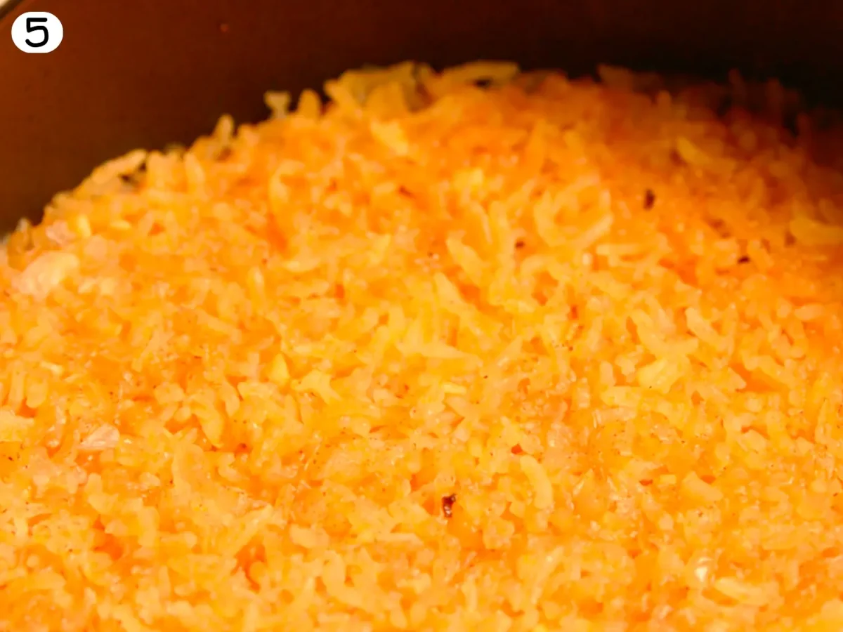 step 5 showing rice after it is cooked and cilantro removed