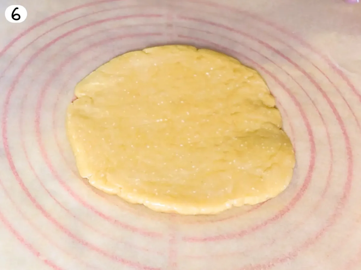 step 6 photo showing cooled dough disc added to parchment paper